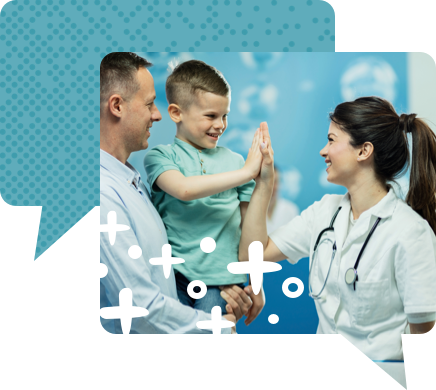 Man carrying child who is high-fiving a health care provider